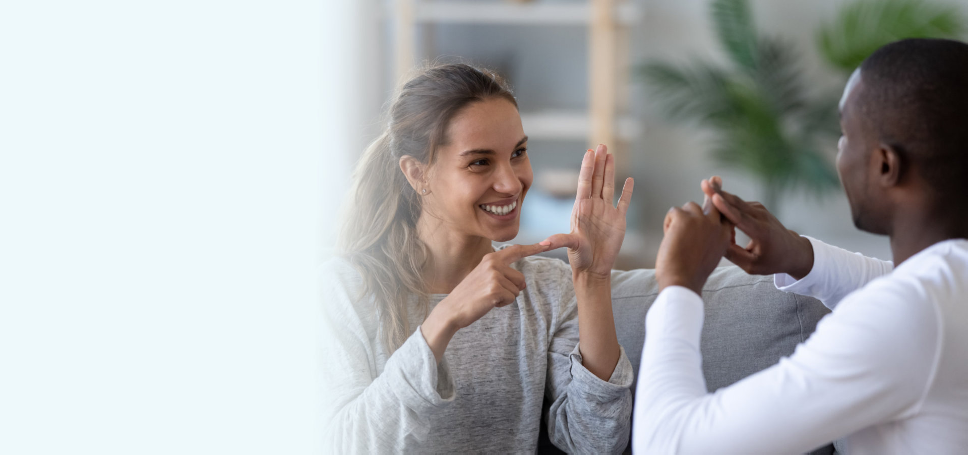 caregiver and young man doing hand gesture