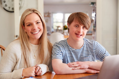 adult woman and young woman smiling