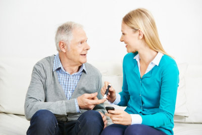 senior man and adult woman are looking at each other