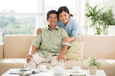 senior man and adult woman smiling