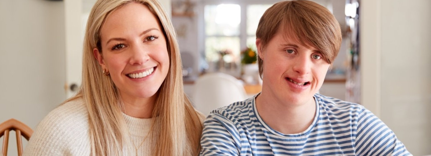 adult woman and young woman smiling