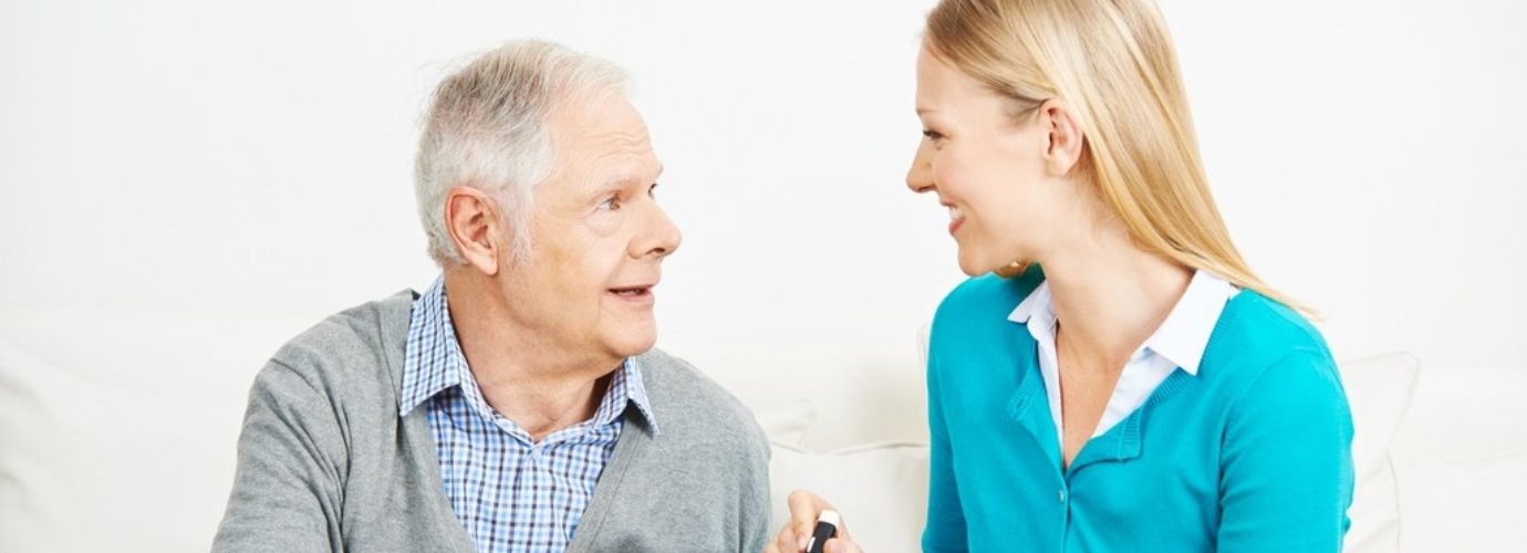 senior man and adult woman are looking at each other