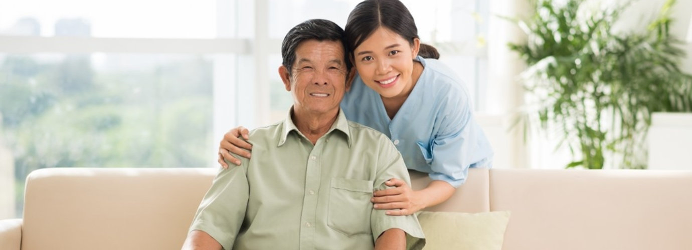 senior man and adult woman smiling